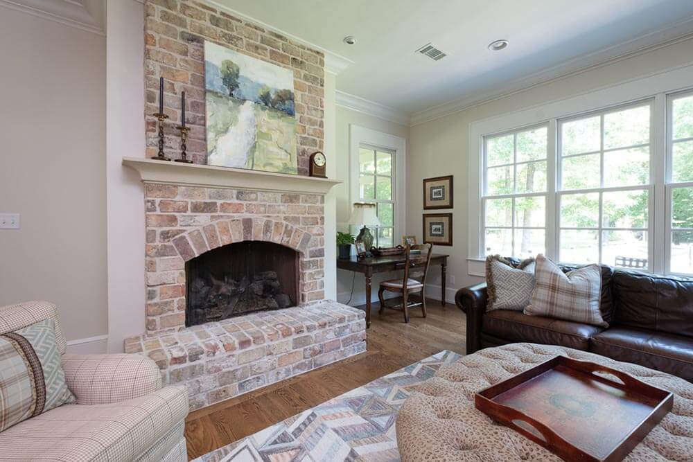 Light red colored, exposed brick fireplace