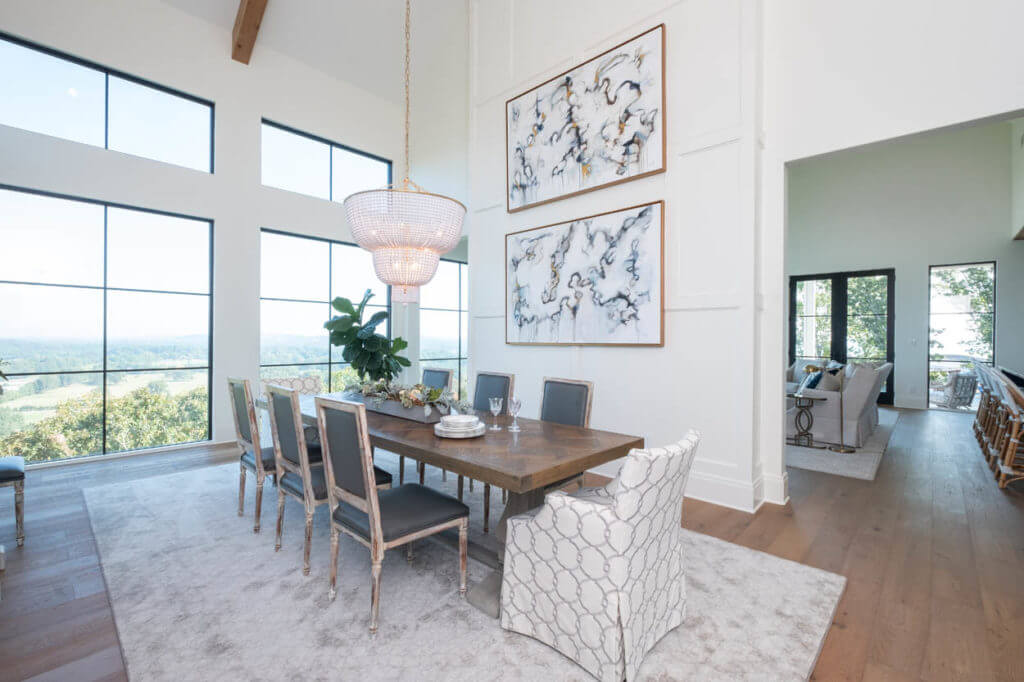 Transitional, white dining room with strong geometric lines, accented by classical curves. 